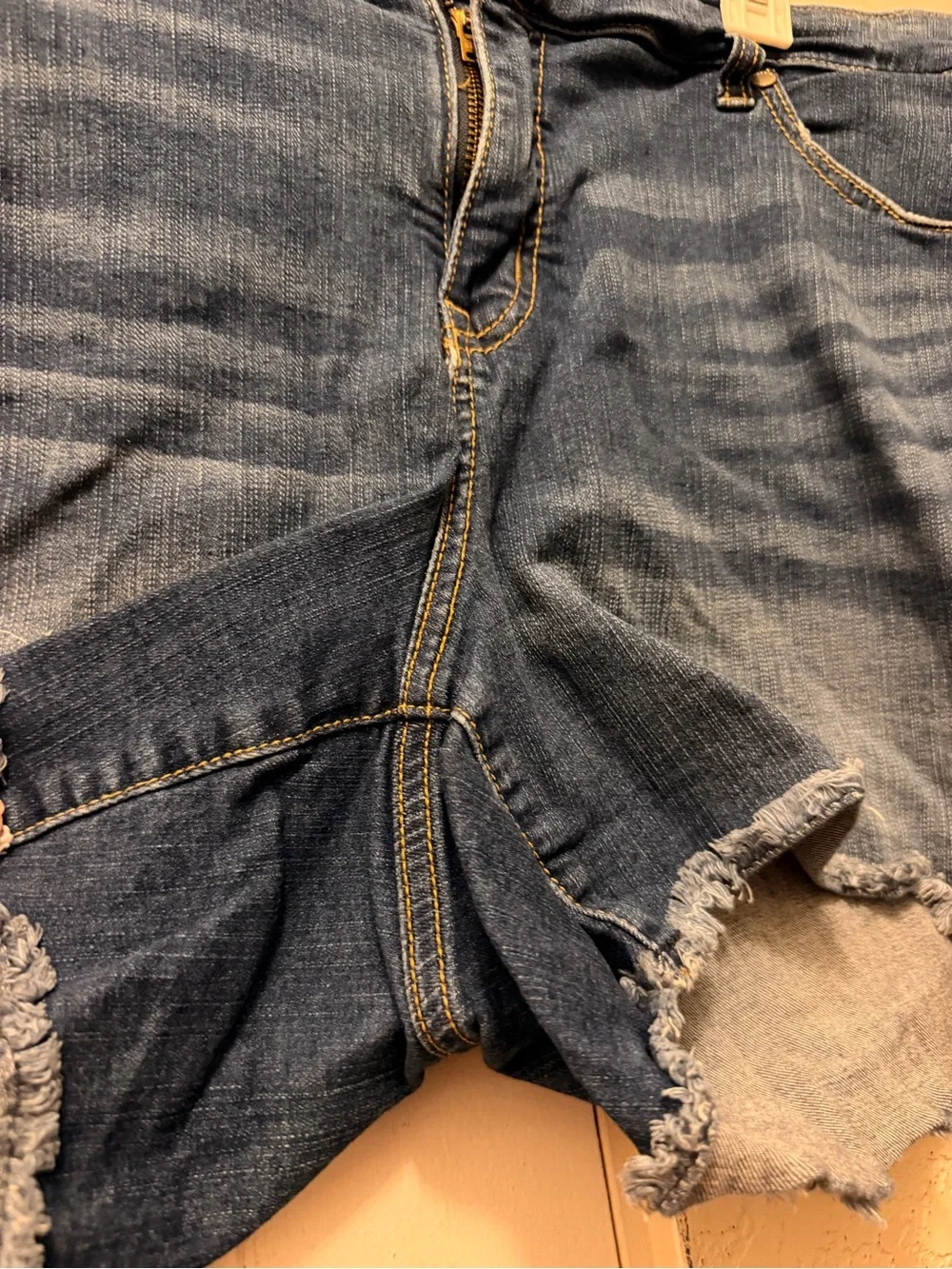 Torrid distressed jeans shorts with black flowy tank -